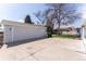 Spacious garage with concrete driveway and room for multiple vehicles and storage at 4164 W Eldorado Pl, Denver, CO 80236