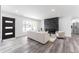 Open-concept living space featuring a fireplace, modern flooring, and stylish furnishings at 4164 W Eldorado Pl, Denver, CO 80236