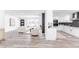 Bright, open-concept living space with modern finishes and a seamless flow into the kitchen area at 4164 W Eldorado Pl, Denver, CO 80236