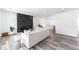 Modern living room with fireplace, neutral tones, and ample natural light at 4164 W Eldorado Pl, Denver, CO 80236