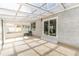 Spacious sunroom with a tile floor and access to backyard at 4164 W Eldorado Pl, Denver, CO 80236