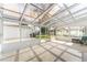 Bright sunroom with vaulted glass ceiling and multiple access doors at 4164 W Eldorado Pl, Denver, CO 80236