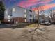 Charming multi-story home with a well-maintained front yard, landscaped bushes, and an asphalt parking lot at 7665 E Eastman Ave # 110, Denver, CO 80231