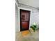 Charming front door with decorative wreath, potted plant, and welcome mat at 7665 E Eastman Ave # 110, Denver, CO 80231