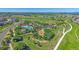 An aerial view of the community pool with walking trails, mature trees, and ample parking at 1901 Corner Rock Ln, Castle Rock, CO 80108