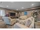 Cozy basement with comfortable seating, a TV, and sports-themed decorations at 1901 Corner Rock Ln, Castle Rock, CO 80108