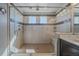 Modern bathroom featuring a frameless glass shower with built-in shelves and tiled surround at 1901 Corner Rock Ln, Castle Rock, CO 80108