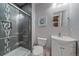 Modern bathroom featuring a glass-enclosed shower with tile accents and a contemporary vanity with storage at 1901 Corner Rock Ln, Castle Rock, CO 80108