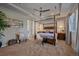 Luxurious main bedroom features a four-poster bed, ceiling fan, and elegant decor at 1901 Corner Rock Ln, Castle Rock, CO 80108