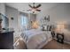 Comfortable bedroom with soft lighting, a ceiling fan, and plush carpeting at 1901 Corner Rock Ln, Castle Rock, CO 80108