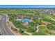 An aerial view of the community pool with walking trails, playground, and mature trees at 1901 Corner Rock Ln, Castle Rock, CO 80108