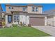 Beautiful two-story home with a well-manicured lawn and charming curb appeal at 1901 Corner Rock Ln, Castle Rock, CO 80108