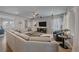 Bright living room with sectional sofa, ceiling fan, and modern decor at 1901 Corner Rock Ln, Castle Rock, CO 80108