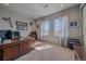 Spacious home office with a large desk, two windows, and neutral decor at 1901 Corner Rock Ln, Castle Rock, CO 80108