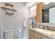 Contemporary bathroom featuring granite countertop, stylish fixtures, and bright lighting at 14058 E Temple Dr, Aurora, CO 80015