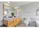 Bright bathroom with double sinks, granite countertops, and stylish fixtures at 14058 E Temple Dr, Aurora, CO 80015