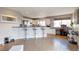 Modern kitchen with granite countertops, stainless steel appliances, and an adjacent office space at 14058 E Temple Dr, Aurora, CO 80015