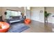 Bright living room featuring hardwood floors, modern furniture, and an open layout perfect for relaxation at 14058 E Temple Dr, Aurora, CO 80015