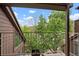 Balcony overlooking mature trees and nature on a bright, sunny day at 832 S Vance St # F, Lakewood, CO 80226