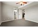 Spacious bedroom features carpet, nearby bathroom, and easy access to other rooms at 832 S Vance St # F, Lakewood, CO 80226
