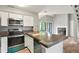Modern kitchen with stainless steel appliances, tile countertops, an open floor plan and lots of light at 832 S Vance St # F, Lakewood, CO 80226