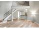 Inviting living room features modern flooring, an open floor plan, and a staircase to the second level at 832 S Vance St # F, Lakewood, CO 80226