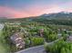 Aerial view pinpoints property in a verdant setting, framed by majestic mountain views at 33 Broken Lance Dr # 207S, Breckenridge, CO 80424