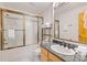 Clean bathroom featuring a tub-shower combo, modern vanity, and tiled floors at 33 Broken Lance Dr # 207S, Breckenridge, CO 80424
