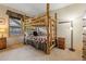 Bedroom featuring rustic log-style bunk beds, side table and lamp, with a window view at 33 Broken Lance Dr # 207S, Breckenridge, CO 80424