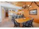 Open dining area adjacent to kitchen with high ceilings at 33 Broken Lance Dr # 207S, Breckenridge, CO 80424
