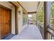 Covered entrance with wood accents provides a welcoming approach to the home at 33 Broken Lance Dr # 207S, Breckenridge, CO 80424