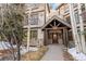 Inviting building entrance with a log beam entry, stone accents, and a well-maintained walkway, providing a welcoming arrival at 33 Broken Lance Dr # 207S, Breckenridge, CO 80424