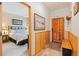 Welcoming entryway with a rustic wood door, horseshoe detail, and a glimpse into the cozy bedroom at 33 Broken Lance Dr # 207S, Breckenridge, CO 80424