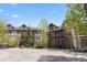 Attractive multi-story condo building with balconies, mature trees, and ample parking at 33 Broken Lance Dr # 207S, Breckenridge, CO 80424