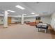 Expansive game room with ping pong table, TV, comfortable seating, air hockey and entertainment options at 33 Broken Lance Dr # 207S, Breckenridge, CO 80424