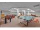 Spacious game room with ping pong table, pool table, foosball, and comfortable seating areas at 33 Broken Lance Dr # 207S, Breckenridge, CO 80424