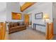 Cozy living room features a comfortable couch and wood accents at 33 Broken Lance Dr # 207S, Breckenridge, CO 80424