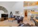 Spacious living room with a stone fireplace, comfortable seating, and open access to the kitchen and dining area at 33 Broken Lance Dr # 207S, Breckenridge, CO 80424