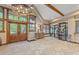 Spacious lobby features stone flooring, large windows, wooden beams, and ample natural light at 33 Broken Lance Dr # 207S, Breckenridge, CO 80424