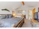 Spacious bedroom boasts wood beam and ensuite bathroom with a view at 33 Broken Lance Dr # 207S, Breckenridge, CO 80424
