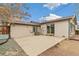 Backyard patio with an air conditioning unit and sliding glass door access to the home at 180 W 78Th Pl, Denver, CO 80221