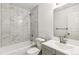 Modern bathroom features marble-tiled walls and a contemporary vanity at 180 W 78Th Pl, Denver, CO 80221