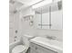 Bathroom featuring a shower-tub combo, toilet, vanity, mirror, and towel rack at 180 W 78Th Pl, Denver, CO 80221