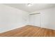 Hardwood floors highlight this bedroom with closet doors at 180 W 78Th Pl, Denver, CO 80221