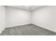 Bedroom with gray carpet, white walls and trim, and a ceiling mounted light at 180 W 78Th Pl, Denver, CO 80221