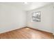 Bedroom featuring hardwood floors and a bright window at 180 W 78Th Pl, Denver, CO 80221