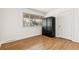 Bright bedroom features hardwood floors and a large window at 180 W 78Th Pl, Denver, CO 80221