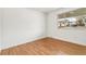 This bedroom features hardwood floors and a bright window at 180 W 78Th Pl, Denver, CO 80221