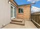 Outdoor patio area featuring brick accents and a convenient entryway into the home at 180 W 78Th Pl, Denver, CO 80221