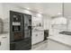 Modern kitchen featuring white cabinets, stainless steel appliances, marble countertops, and subway tile backsplash at 180 W 78Th Pl, Denver, CO 80221